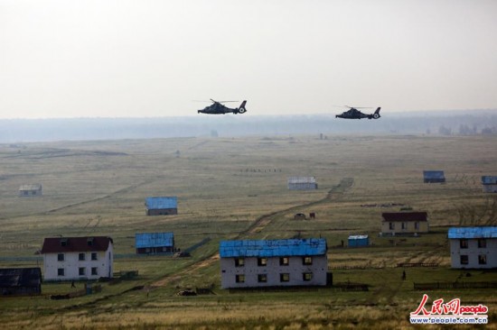 高清：中俄军演首场飞行训练 直升机平飞导弹攻击